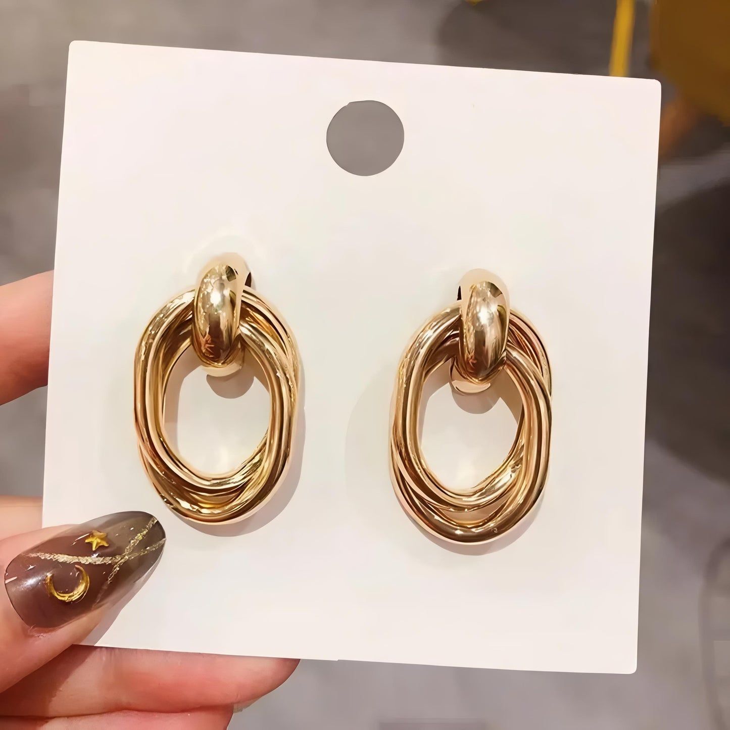 Gold Double Twist Loop Hoop Earrings by GLEAMY