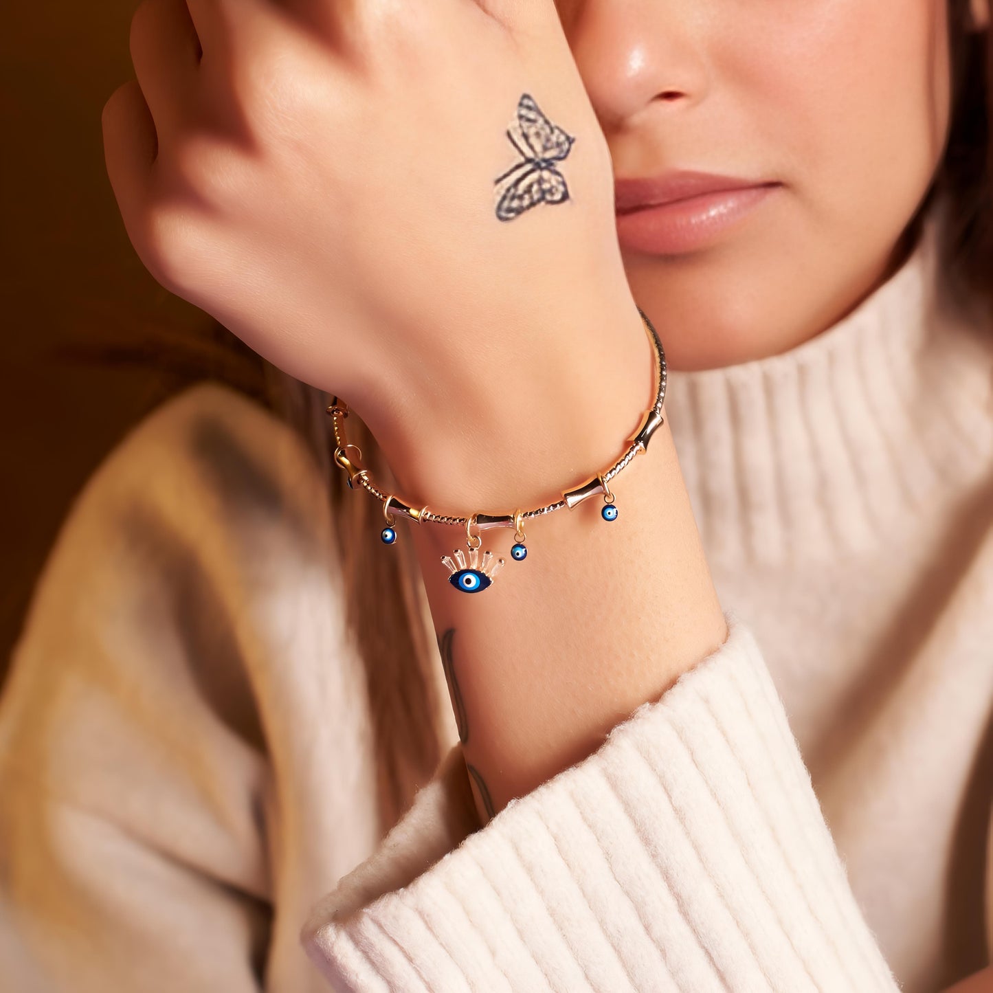Chic Evil Eye Tassel Bangle By Gleamy