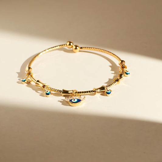 Chic Evil Eye Tassel Bangle By Gleamy